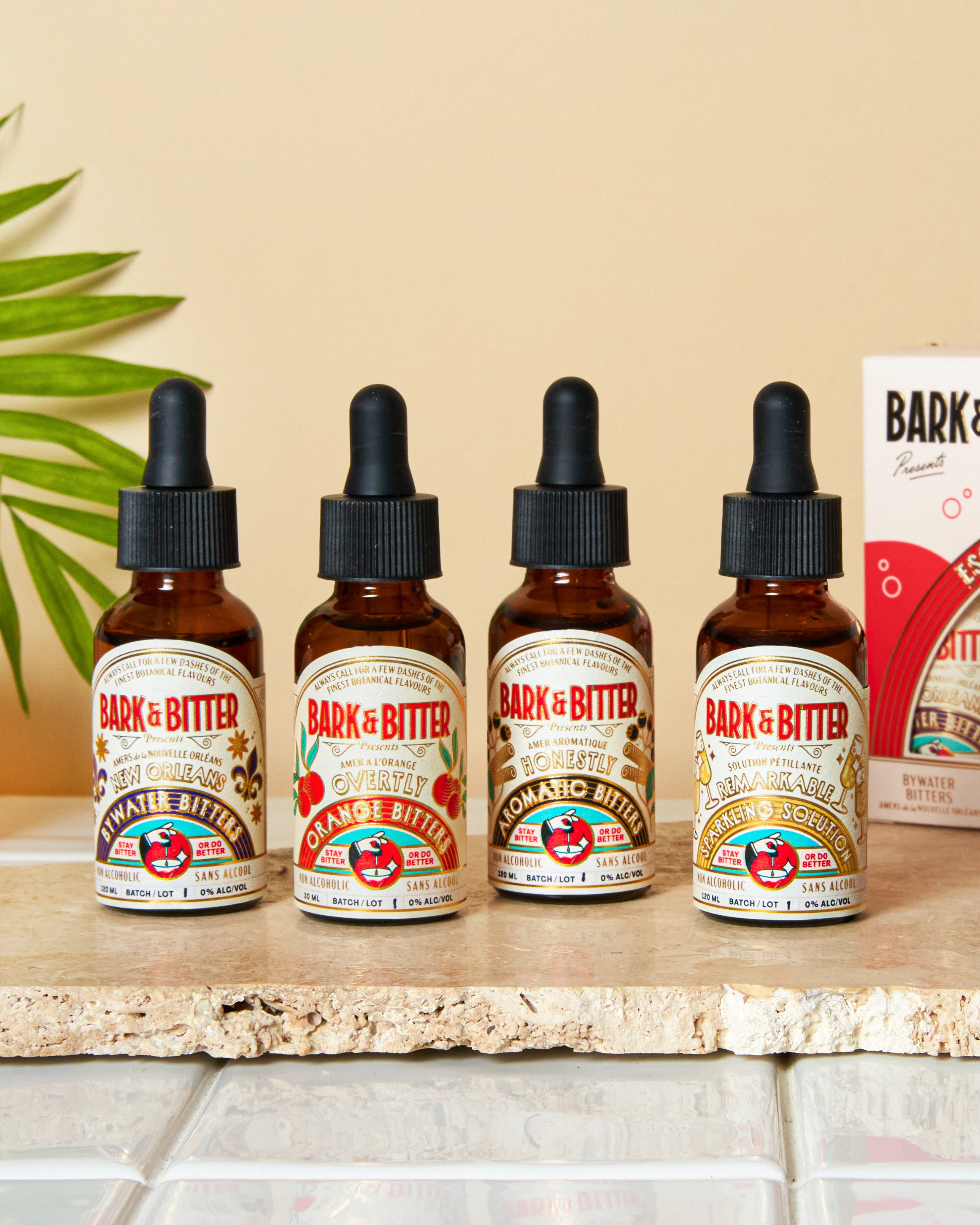 Close-up view of Bark & Bitter’s Essential Cocktail Bitters Sampler Kit showing 1oz bottles of non-alcoholic bitters, perfect for gifting and sampling new flavors.