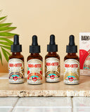 Close-up view of Bark & Bitter’s Essential Cocktail Bitters Sampler Kit showing 1oz bottles of non-alcoholic bitters, perfect for gifting and sampling new flavors.