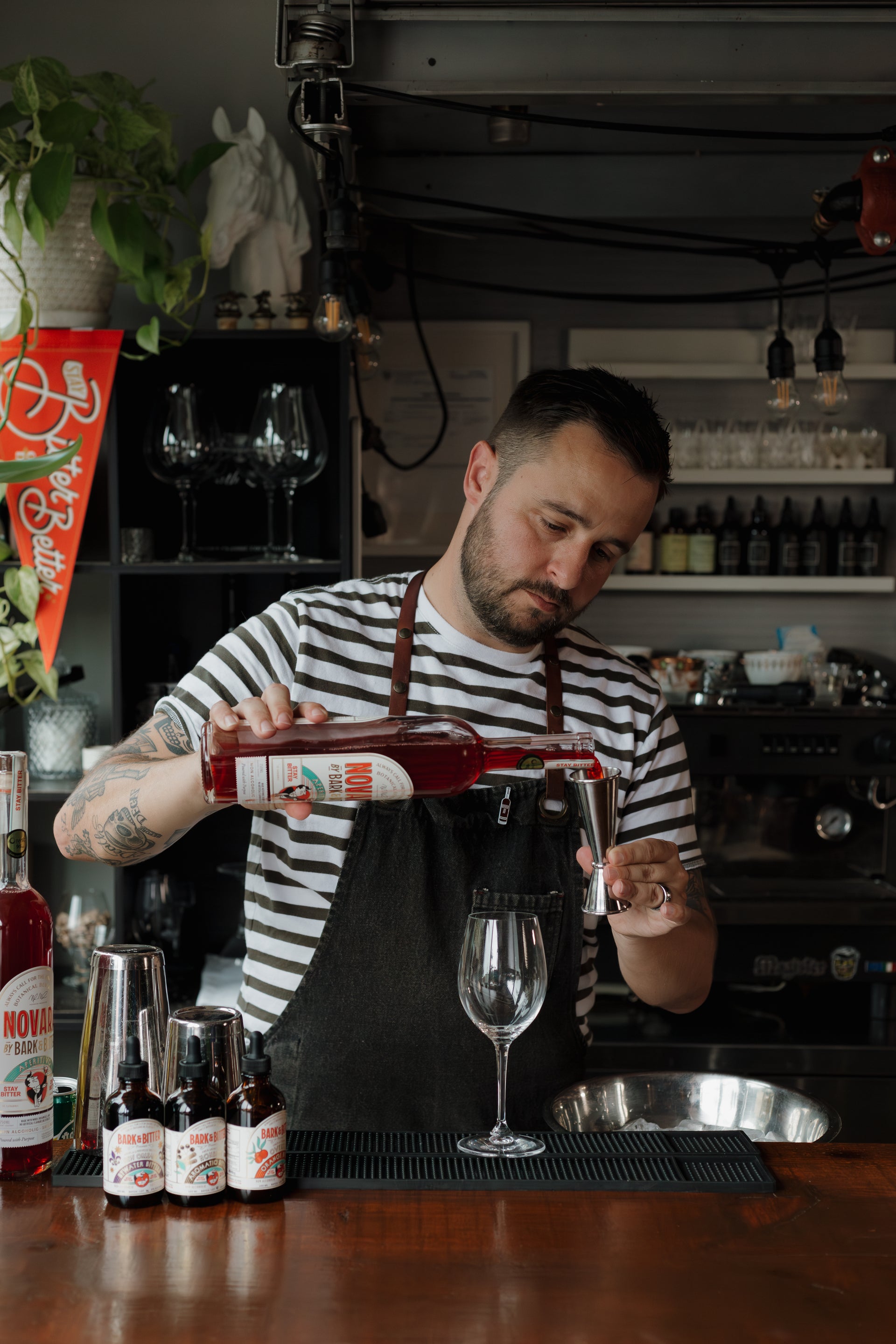 Bark & Bitter founder Nick Nemeth pouring Novara Aperitivo, the brand's non-alcoholic aperitivo